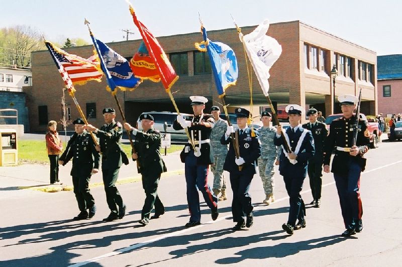 A mixed group of Service personnel make up the Color Guard.