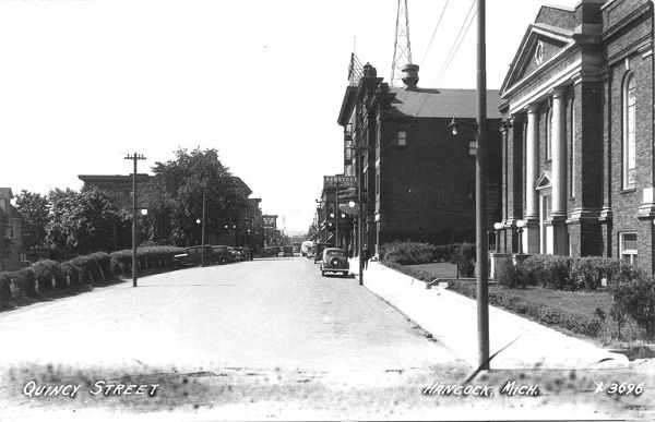 Taken from Dunstan St./Quincy St. intersection, looking westward on Quincy St., with the Congregational Church (R), Kerredge Theater (mid R), and the Scott Hotel, with a Weather Radio Tower (WWII) on top.